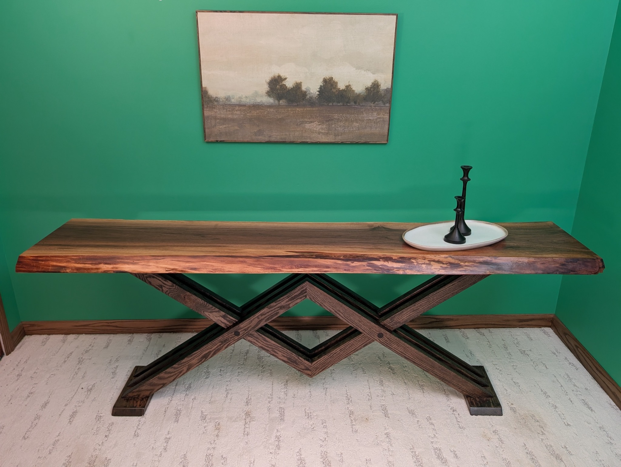 Straight-on view of the long walnut console and interlocking base