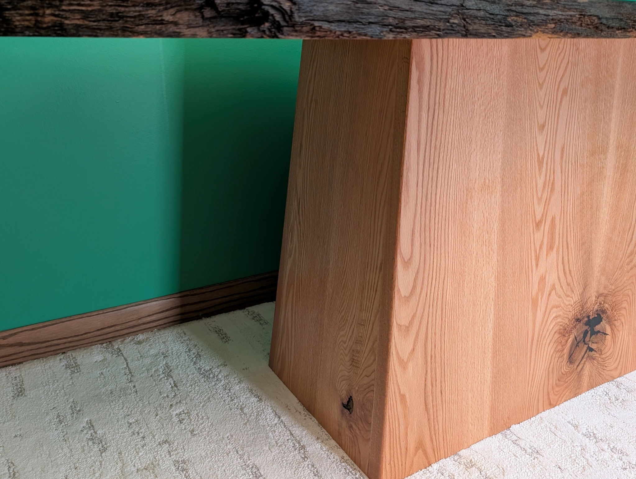Side view showing the pedestal’s substantial tapered depth